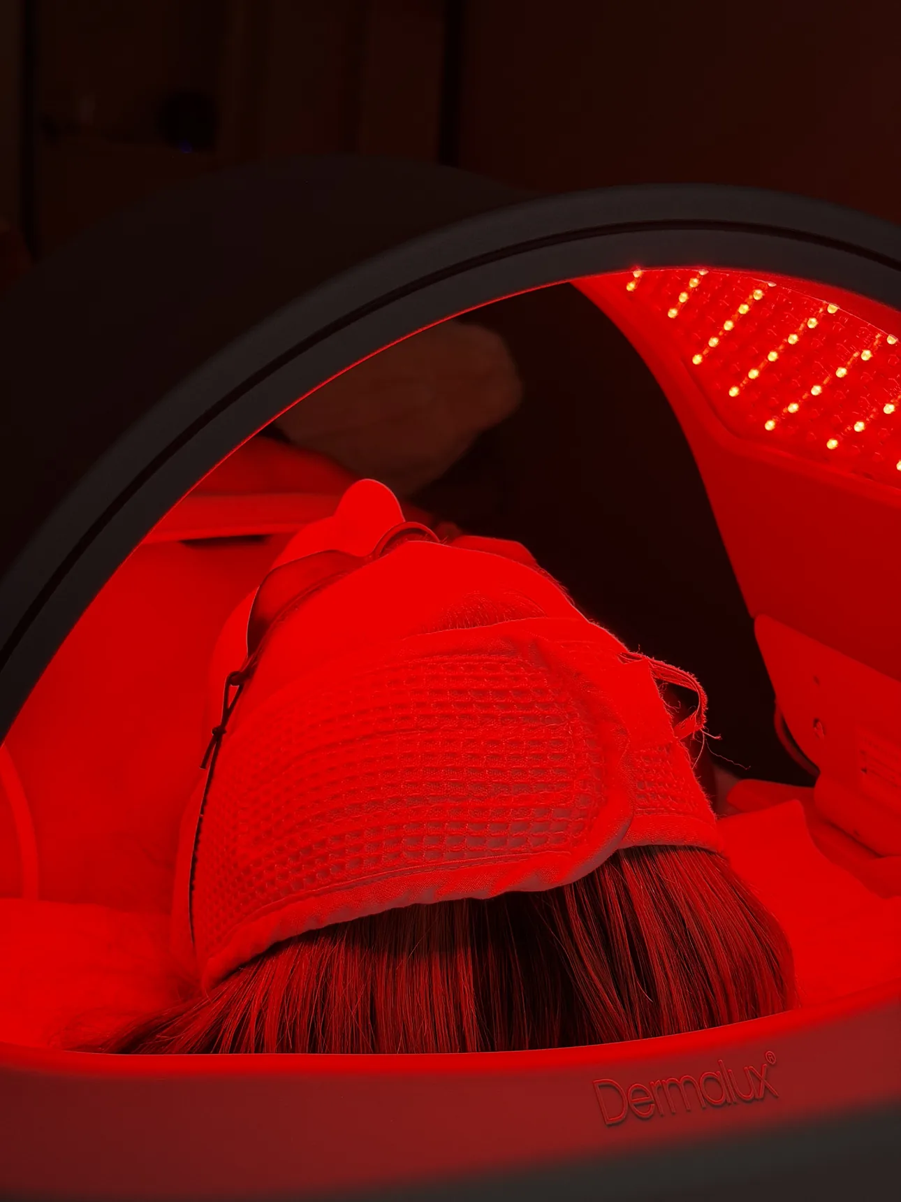 Medical-grade Dermalux LED Light Therapy treatment hood